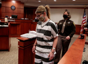 FILE PHOTO: FILE PHOTO: Jennifer Crumbley, parent of accused Oxford High School gunman Ethan Crumbley, is escorted into th...
