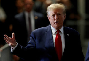 FILE PHOTO: Former U.S. President Trump attends a hearing on a criminal case linked to a hush money payment, in New York City