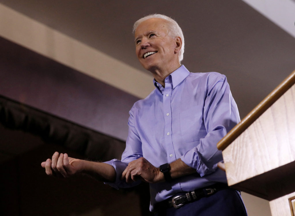 FILE PHOTO: Then Democratic U.S. presidential candidate Joe Biden rolls up his sleeves as he addresses union workers at th...
