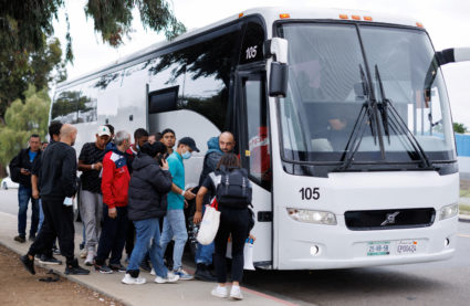 Migrants collected at the border and processed by U.S. Customs and Border Patrol board a bus at a transit center in San Diego, California U.S., February 29, 2024. Photo by Mike Blake/Reuters