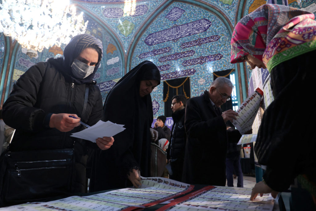 Iranians vote during the parliamentary election at a polling station in Tehran, Iran, March 1, 2024. Photo by Majid Asgari...