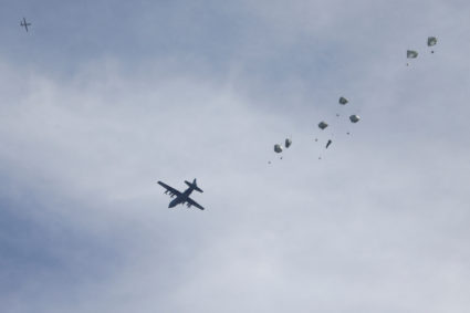 A plane drops aid over Gaza, amid the ongoing the conflict between Israel and Hamas, in Gaza City, March 1, 2024. Photo by Kosay Al Nemer/Reuters