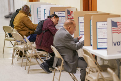 Voters cast their ballots during early voting at San Francisco City Hall