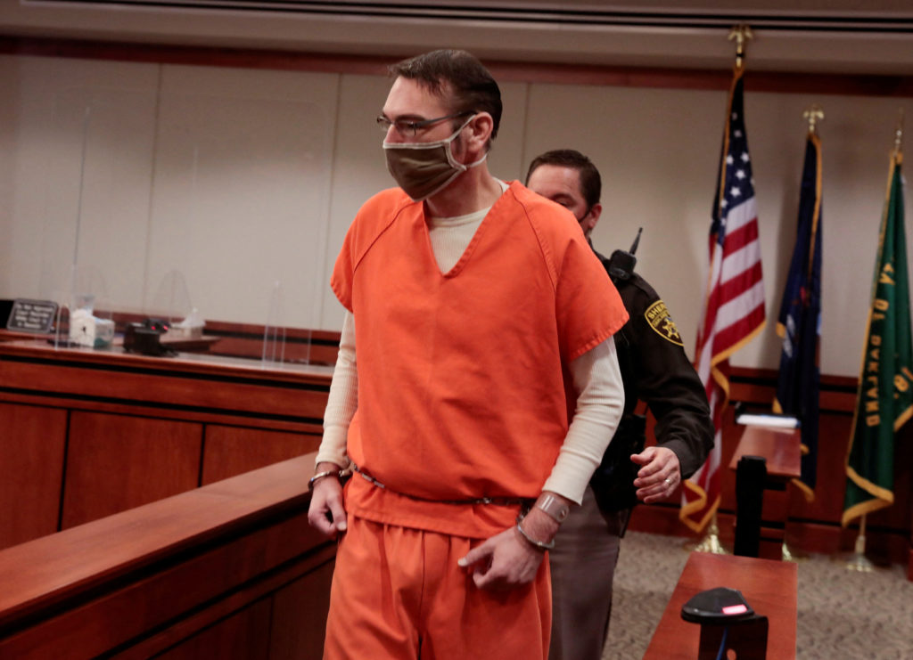 FILE PHOTO: James Crumbley, parent of accused Oxford High School gunman Ethan Crumbley, is escorted into the courtroom by ...