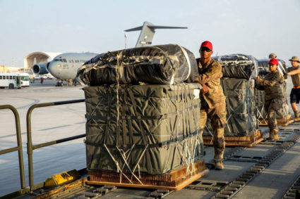 FILE PHOTO: U.S. Air Force members work on the preparation of a humanitarian aid drop for Gaza residents, in this picture released on March 5, 2024. US Central Command via X/Handout via REUTERS