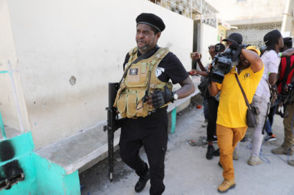 Former police officer Jimmy "Barbecue" Cherizier addresses the media, in Port-au-Prince