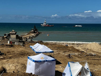 Aid supply ship from Cyprus reaches Gaza coast but weather slows delivery