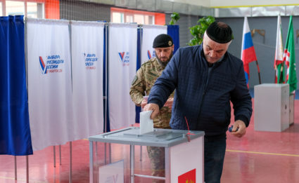 A man casts his ballot at a polling station during the presidential election in Grozny