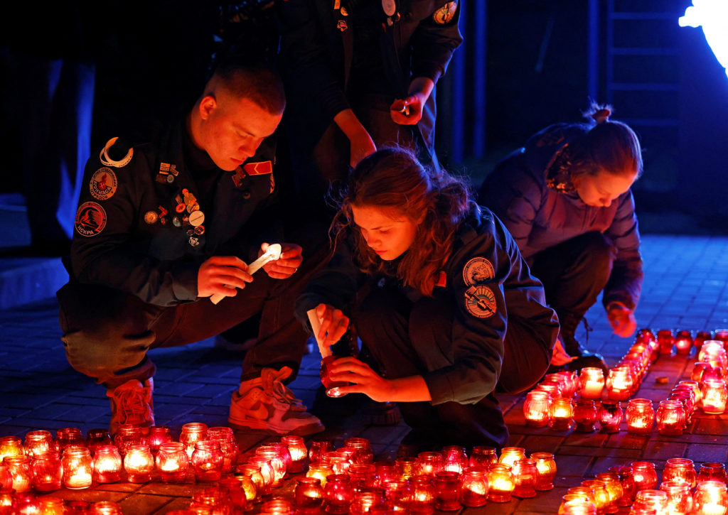 People pay tribute to the victims of a shooting attack at Moscow concert hall, in Donetsk