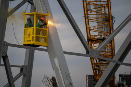 Demolition crews cut the top portion of the north side of the collapsed bridge into smaller sections in Baltimore