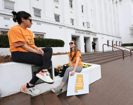 Supporters of legislation safeguarding IVF treatments hold a rally at the Alabama State House
