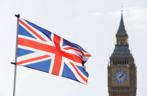 The Britain's national flag flies next to the Elizabeth Tower, commonly known as Big Ben, on national day of reflection to...