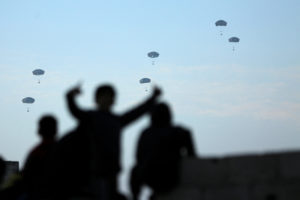 U.S. military carries out its first aid drop over Gaza, amid the ongoing the conflict between Israel and the Palestinian I...