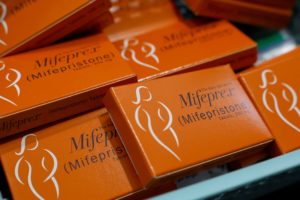 A container holding boxes of Mifepristone, the first medication in a medical abortion, are prepared for patients at Alamo ...