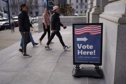 Voters cast their ballots during early voting at San Francisco City Hall