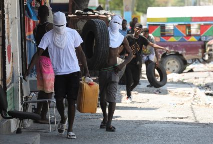 Former police officer Jimmy "Barbecue" Cherizier addresses the media, in Port-au-Prince