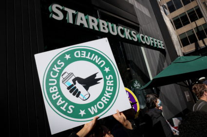 Members of the Starbucks Workers Union picket and hold a rally outside Starbucks store in New York