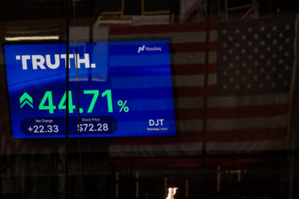 A screen displays trading information about shares of Truth Social and Trump Media &amp; Technology Group, outside the Nasdaq Market site in New York City, U.S., March 26, 2024. Photo by Brendan McDermid/Reuters