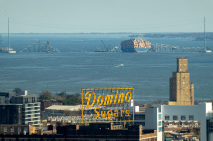 Salvage cranes on barges are anchored at the wreckage of the Francis Scott Key Bridge in Baltimore
