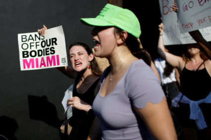 FILE PHOTO: An abortion rights protester holds a sign as she demonstrates after the U.S. Supreme Court ruled in the Dobbs v Women's Health Organization abortion case, overturning the landmark Roe v Wade abortion decision in Miami, Florida, U.S. June 24, 2022. Photo by Marco Bello/Reuters