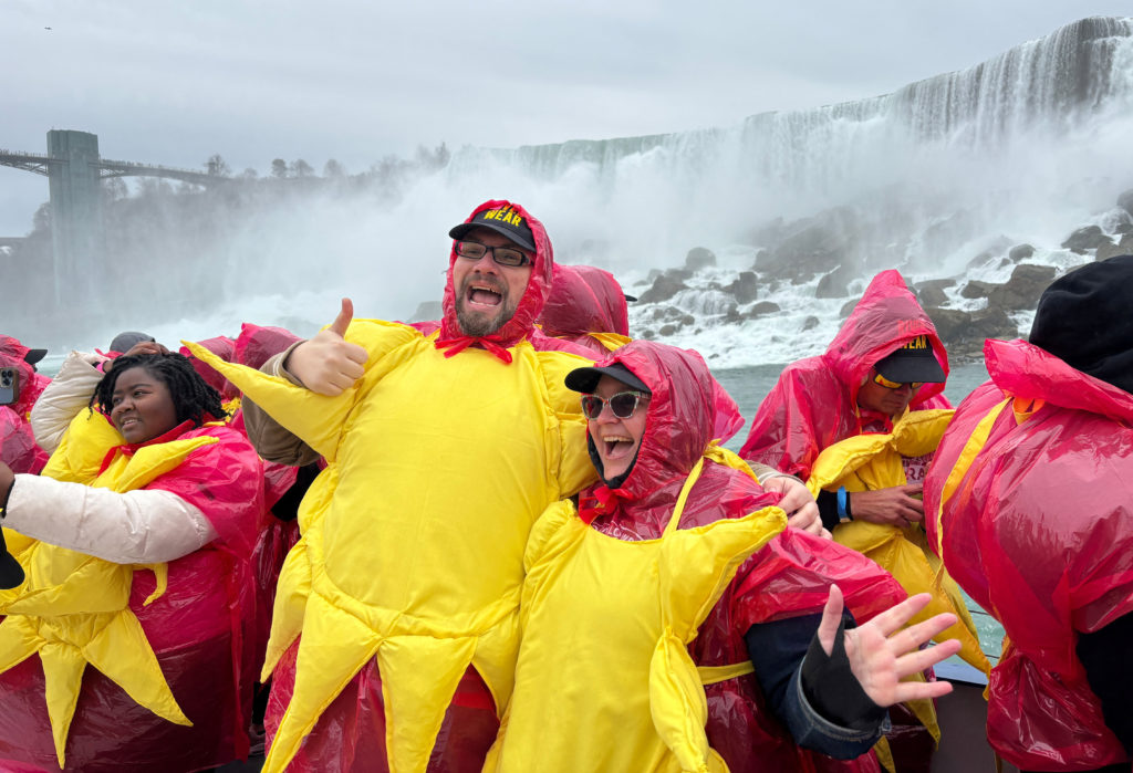 Some of the 309 people dressed as the sun to break the Guinness World Record before the solar eclipse in Niagara Falls