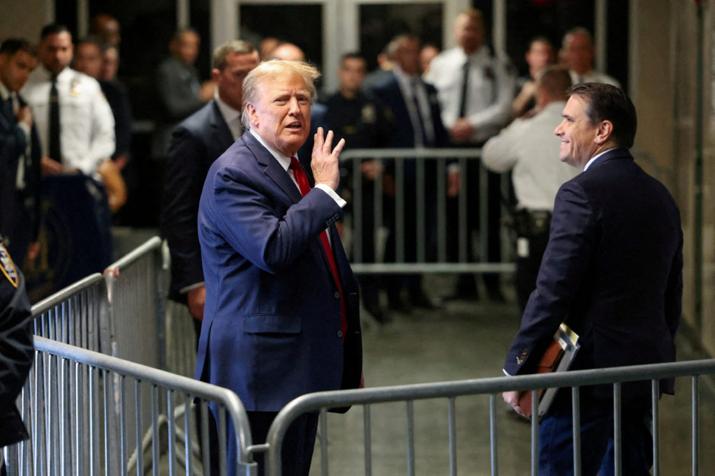 FILE PHOTO: Former U.S. President Trump attends a hearing on a criminal case linked to a hush money payment, in New York City