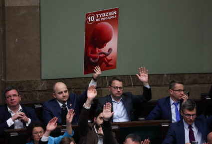 Law and Justice member of parliament Dariusz Matecki holds a poster during voting on sending four bills on the liberalisation of abortion laws to be analysed by a special commission, at the parliament in Warsaw, Poland, April 12, 2024. Photo by Kacper Pempel/Reuters