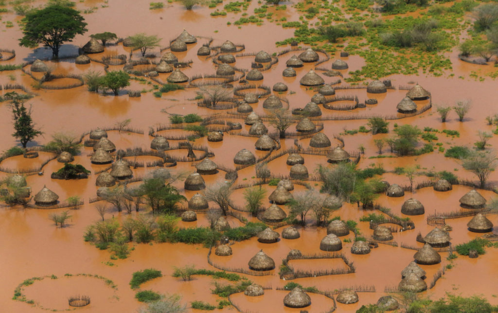 FILE PHOTO: An aerial view shows a deserted and flooded traditional homestead following heavy rains in Garsen, Tana Delta ...