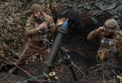 FILE PHOTO: Ukrainian servicemen fire a mortar towards Russian troops at a frontline near the town of Bakhmut