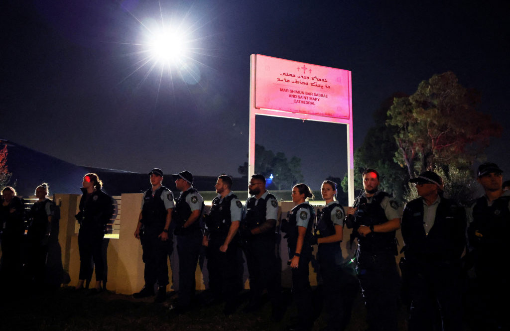 Police stand outside the Mar Shimun Bar Sabbae & Saint Mary Cathedral following a stabbing at Christ The Good Shepherd...