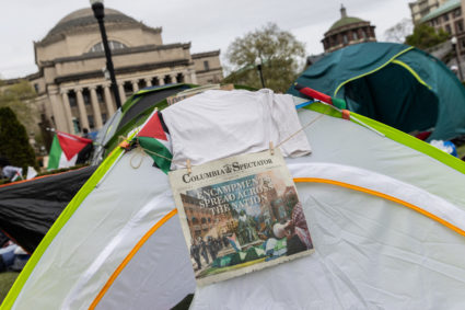 A newspapers hangs on a tent during a protest encampment in support of Palestinians on the Columbia University campus, dur...