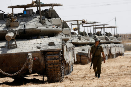 Israeli tanks park near the Israel-Gaza border in Israel