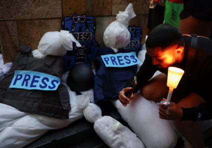 South African journalists hold a vigil for journalists killed during the ongoing conflict in Gaza