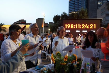 People attend a seder in support of hostages kidnapped in the deadly October 7 attack, in Tel Aviv