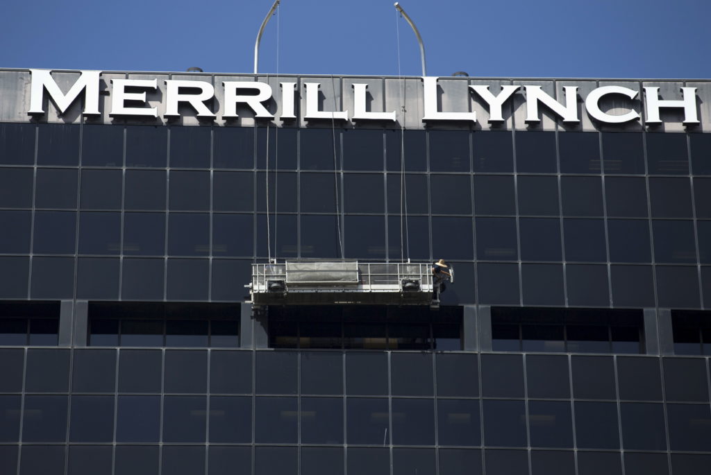 A worker washes windows high atop the Merrill Lynch building in downtown San Diego, California September 1, 2015. Photo by Mike Blake/Reuters