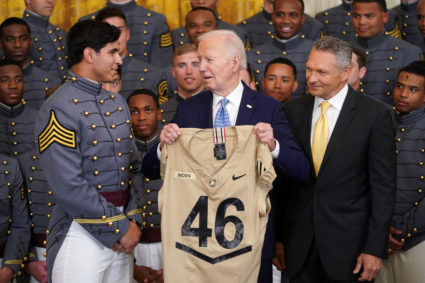 U.S. President Joe Biden receives a jersey from team captain Jimmy Ciarlo and head coach Jeff Monken during an event honoring the Commander-in-Chief's Trophy winners, the United States Military Academy Army Black Knights football team, at the White House in Washington, U.S., May 6, 2024. Photo by Kevin Lamarque/Reuters