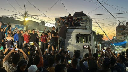 Palestinians react after Hamas accepted a ceasefire proposal from Egypt and Qatar, in Rafah