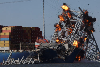 Explosives are detonated to free the container ship Dali, after it was trapped following its collision with the Francis Scott Key Bridge, causing it to collapse, in Baltimore, Maryland, U.S. May 13, 2024. Photo by Leah Millis/Reuters
