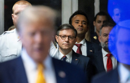 U.S. Speaker of the House Mike Johnson and businessman Vivek Ramaswamy listen as former US President Donald Trump talks with reporters as he arrives for his criminal trial at New York State Supreme Court in New York, New York, U.S., 14 May 2024. Photo by JUSTIN LANE/Pool via REUTERS