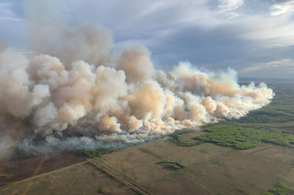 FILE PHOTO: Smoke rises from mutual aid wildfire GCU007 in the Grande Prairie Forest Area