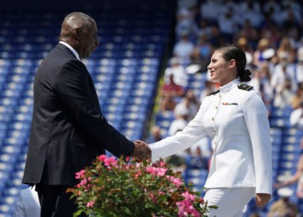 U.S. Secretary of Defense Lloyd Austin congratulates a graduate during the commissioning and graduation ceremony at the U.S. Naval Academy in Annapolis, Maryland, U.S., May 24, 2024. Photo by Kevin Lamarque/Reuters