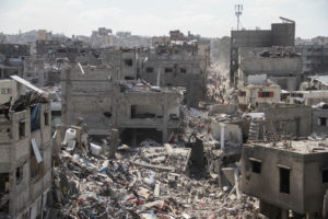 Palestinians inspect the damages after Israeli forces withdrew from a part of Jabalia refugee camp, in the northern Gaza S...