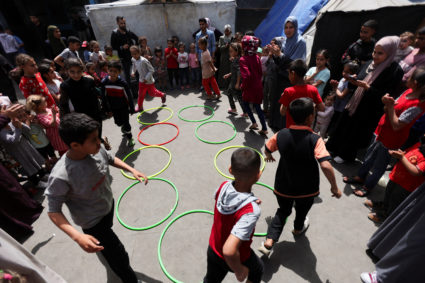 Displaced Palestinians shelter in UNRWA-affiliated school, in Deir Al-Balah