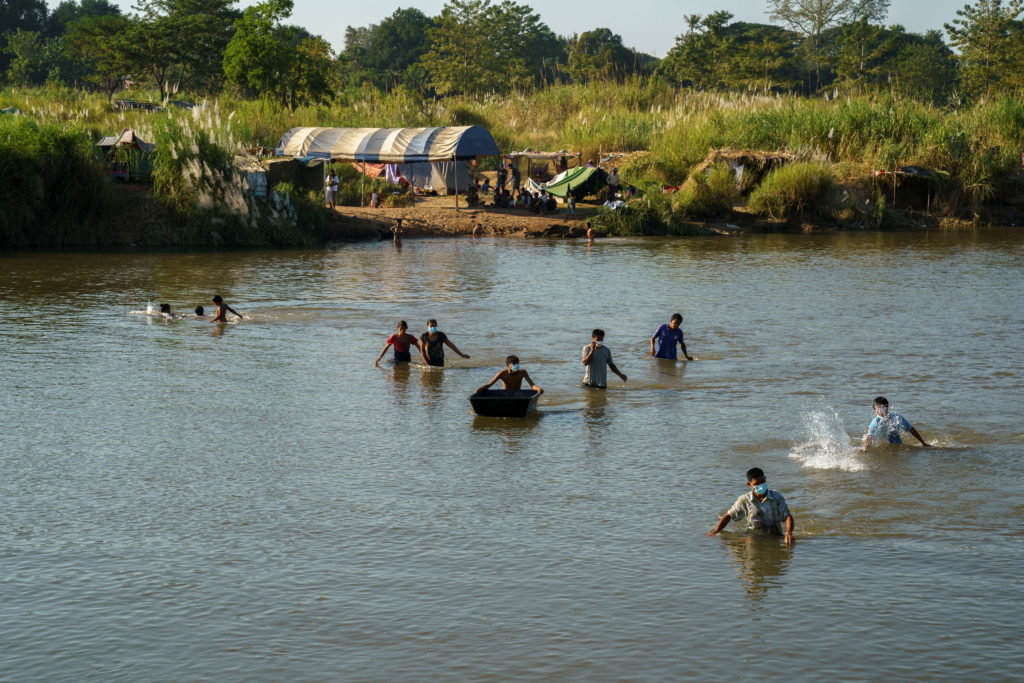 Myanmar refugees receive aid from Thailand on the Thai-Myanmar border, in Mae Sot