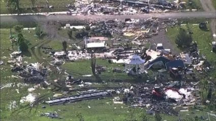 Wreckage is strewn across a property the day after a deadly series of tornados in Texas