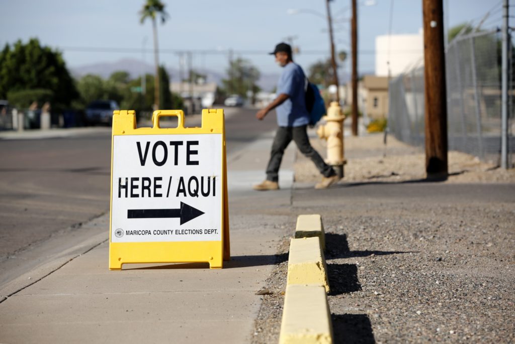 Sign in English and Spanish points people to a polling place in El Mirage, Arizona