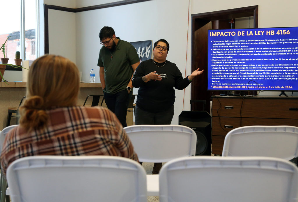 CJ Garcia of DREAM Action Oklahoma, addresses a small crowd on how to protect themselves after Oklahoma Gov. Kevin Stitt signed HB 4156, which allows law enforcement to arrest people living in the U.S. without documentation. Photo by Adam Kemp/PBS NewsHour