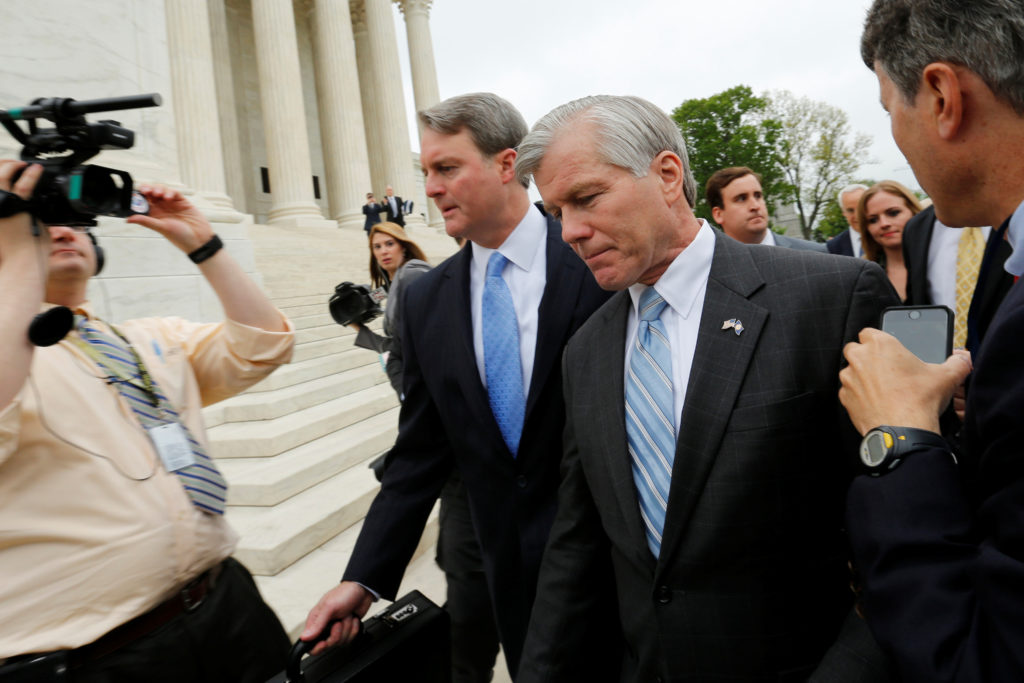 Former Virginia Governor McDonnell is trailed by reporters as he departs after his appeal of his 2014 corruption convictio...