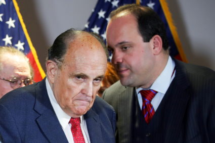 Trump campaign advisor Epshteyn speaks to Giuliani during a news conference at Republican National Committee headquarters ...