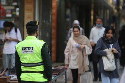 Iranian police force stands on a street during the revival of morality police in Tehran